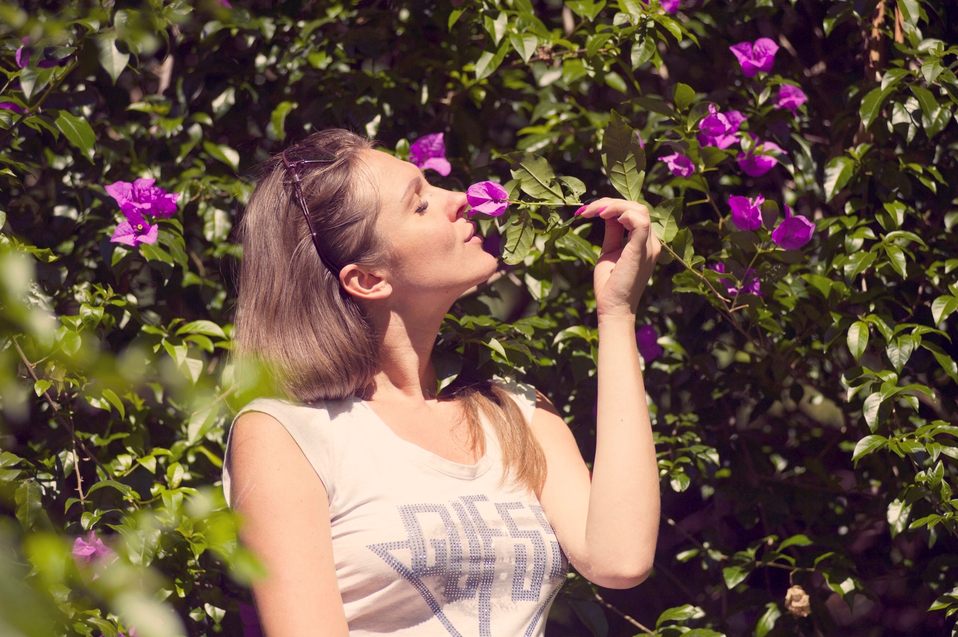 Woman perceiving flower